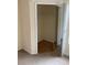 Walk-in closet in the bedroom with carpeted floors and mirrored doors at 5500 Metrowest Blvd # 304, Orlando, FL 32811