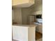 Kitchen area featuring white cabinets and appliances at 5500 Metrowest Blvd # 304, Orlando, FL 32811