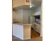 Kitchen area featuring white cabinets and appliances at 5500 Metrowest Blvd # 304, Orlando, FL 32811