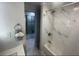 Bathroom with bathtub, shower, and marble-look walls at 9000 Us Highway 192 # Lot 316, Clermont, FL 34714