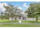 Single-story home with a large front yard and circular driveway at 20406 Racine St, Orlando, FL 32833