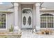 Elegant entryway with double doors and columns at 20406 Racine St, Orlando, FL 32833