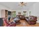 Relaxing living room with leather furniture and a large TV at 20406 Racine St, Orlando, FL 32833