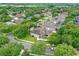 Aerial view of a home in a neighborhood with lush trees and landscaped yards at 706 Santee Terre Ln, Winter Garden, FL 34787