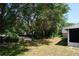 This home has a beautiful backyard with large shade trees and space to enjoy at 1124 Chateau Cir, Minneola, FL 34715
