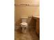 Bathroom featuring a toilet, vanity, and cabinet with a neutral color scheme at 1124 Chateau Cir, Minneola, FL 34715