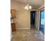 Cozy eat-in kitchen area featuring wood cabinets and adjacent door to backyard access at 1124 Chateau Cir, Minneola, FL 34715