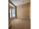 Cozy living room with neutral carpet, a ceiling fan, and natural light from windows at 1124 Chateau Cir, Minneola, FL 34715