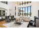 Open-concept living room features large windows offering outdoor views and natural light at 4029 Isabella Cir, Windermere, FL 34786