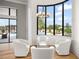 Cozy sitting area with comfortable white chairs, perfect for relaxing and enjoying the view at 4029 Isabella Cir, Windermere, FL 34786