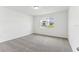 Bedroom featuring neutral carpeting, a window with blinds, and fresh paint at 1489 Sea Glass Rd, Haines City, FL 33844