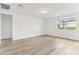 Bright living room featuring hard surface floors and a window at 1489 Sea Glass Rd, Haines City, FL 33844