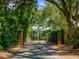 Private entrance gate leading to a secluded lakefront property at 1126 Kelso Blvd, Windermere, FL 34786