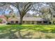 Ranch-style home with brick accents and a spacious lawn at 1126 Kelso Blvd, Windermere, FL 34786