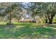 Ranch-style home nestled among lush greenery and large trees at 1126 Kelso Blvd, Windermere, FL 34786