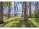 Expansive lakefront property with lush vegetation at 1126 Kelso Blvd, Windermere, FL 34786