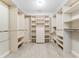 Large walk-in closet with ample shelving and hanging space at 1126 Kelso Blvd, Windermere, FL 34786