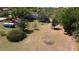 Aerial view of the lot featuring mature trees, green grass, a shed and single Gathering home at 1879 Lake Emma Rd, Longwood, FL 32750