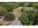 A lush lot with mature trees, green space, and storage shed at 1879 Lake Emma Rd, Longwood, FL 32750