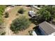 Expansive lot boasts mature trees, green grass, a shed, and charming home at 1879 Lake Emma Rd, Longwood, FL 32750