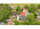 Aerial view of a backyard featuring a pool, wooden deck, and lush green trees at 809 E Ridgewood St, Orlando, FL 32803