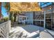 Cozy backyard with wooden deck, shaded seating area, and a charming blue house exterior at 809 E Ridgewood St, Orlando, FL 32803