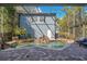 Private backyard with a waterfall feature cascading into a refreshing pool, set against a blue home exterior at 809 E Ridgewood St, Orlando, FL 32803