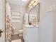 Bathroom featuring a bathtub with shower, decorative shelving, toilet, and white vanity at 809 E Ridgewood St, Orlando, FL 32803