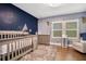 Charming Bedroom with mountain mural and hardwood floors at 809 E Ridgewood St, Orlando, FL 32803