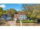 Charming two-story home with manicured lawn, brick driveway, and mature landscaping at 809 E Ridgewood St, Orlando, FL 32803