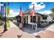 Charming bar & kitchen exterior featuring flags and outdoor seating, creating a welcoming atmosphere at 809 E Ridgewood St, Orlando, FL 32803