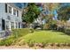 Well-kept front yard with lush green grass, mature trees, and manicured landscaping at 809 E Ridgewood St, Orlando, FL 32803
