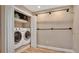 Convenient laundry room featuring washer, dryer, and plenty of storage space at 809 E Ridgewood St, Orlando, FL 32803