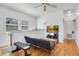 Cozy living room featuring hardwood floors, natural light, and a comfortable seating area at 809 E Ridgewood St, Orlando, FL 32803