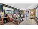 Living room with leather couches, wood coffee table, and large mirror at 809 E Ridgewood St, Orlando, FL 32803