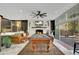 Elegant living room with pool table, fireplace, and comfortable seating, offering stylish entertaining space at 809 E Ridgewood St, Orlando, FL 32803