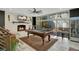 Bright living room features a pool table, fireplace, wet bar and a view to a backyard oasis at 809 E Ridgewood St, Orlando, FL 32803