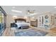 Spacious bedroom featuring hardwood floors, modern ceiling fan, and natural light from skylights at 809 E Ridgewood St, Orlando, FL 32803