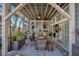 Covered outdoor patio with dining area, outdoor kitchen, and direct access to the interior spaces at 809 E Ridgewood St, Orlando, FL 32803