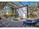 Backyard features a screened pool area with a waterfall, patio, and lounge chairs at 809 E Ridgewood St, Orlando, FL 32803