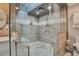 Stylish walk-in shower boasting custom tile, a glass enclosure, and a convenient shower bench at 809 E Ridgewood St, Orlando, FL 32803