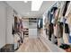 Spacious walk-in closet with custom shelving, ample storage, and a skylight for natural light at 809 E Ridgewood St, Orlando, FL 32803