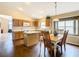 Bright eat-in kitchen featuring laminate flooring, modern appliances, and ample countertop space at 215 Riggs Cir, Davenport, FL 33897