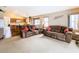 Open living room and kitchen area with eat-in counter and lots of space to entertain at 215 Riggs Cir, Davenport, FL 33897