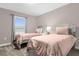 Comfortable bedroom with twin beds, neutral decor, and ample natural light at 4243 Paragraph Dr, Kissimmee, FL 34746
