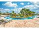 Relaxing lazy river with tropical landscaping and lounge chairs for soaking up the sun at 4243 Paragraph Dr, Kissimmee, FL 34746