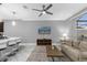 Comfortable living room with modern furnishings, neutral colors, and TV at 4243 Paragraph Dr, Kissimmee, FL 34746