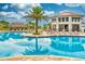 Beautiful community pool features tiki hut, ample seating, and a two-story clubhouse at 4243 Paragraph Dr, Kissimmee, FL 34746