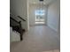 Bright dining room with tile floor and large window at 2018 Packing District Way, Orlando, FL 32804