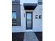 Modern front door with glass panels and brick facade at 2018 Packing District Way, Orlando, FL 32804